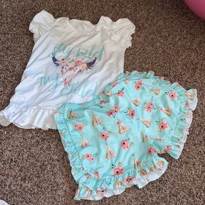 Size 7/8 child shirt/shorts set. Practically new.